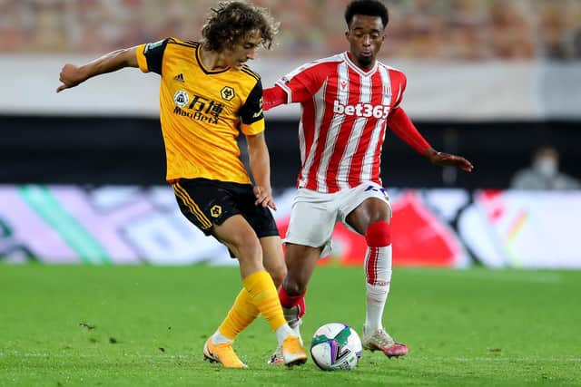 RECORD-BREAKER: Wolves teen Fabio Silva, left, pictured on his debut for his new club in last month's Carabao Cup clash against Stoke City at Molineux. Photo by Catherine Ivill/Getty Images.