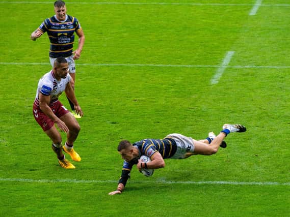 Ash Handley swoops over for the first of his two tries in Rhinos' semi-final win over Wigan. Picture by Bruce Rollinson.