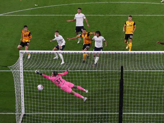 MAIN THREAT - Wolves striker Raul Jimenez, the man for Leeds United to keep a close eye on, watches his header go past a diving Manchester City goalkeeper Ederson. Pic: Getty