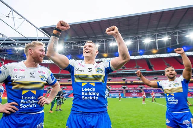 Mikolaj Oledzki celebrates with fellow Leeds Rhinos prop Matt Prior and hooker Kruise Leeming. Picture: Allan McKenzie/SWpix.com.