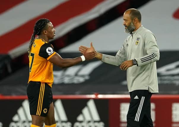 Wolverhampton Wanderers' manager Nuno Espirito Santo and winger Adama Traore celebrate their victory at Sheffield United. Traore could be a big threat to Leeds United tomorrow.  Picture: PA Wire.