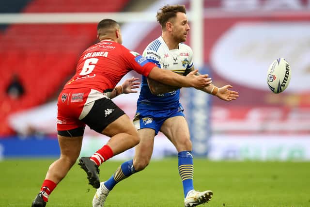Lance Todd trophy winner Richie Myler is challenged by Tui Lolohea of Salford Red Devils. Picture: Michael Steele/Getty Images.