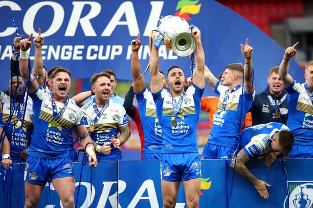 Luke Gale lifts the Coral Challenge Cup following Leeds Rhinos' 17-16 victory over Salford Red Devils at Wembley Stadium. Picture: Michael Steele/Getty Images.