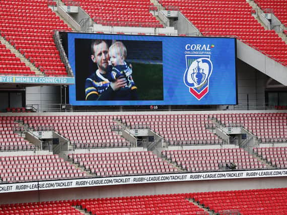 Rob Burrow and his son Jackson appear on the big screen at Wembley. Picture by Ed Sykes/SWpix.com.