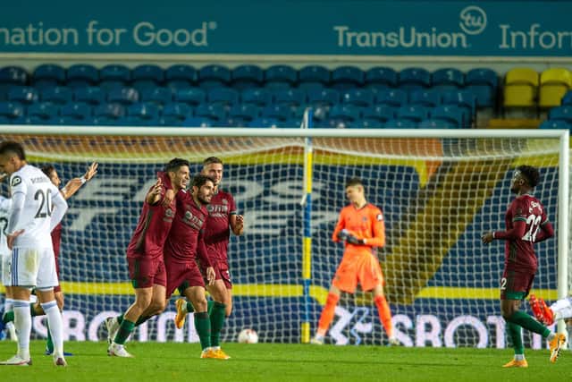 DECISIVE: Wolves celebrate their winning goal in Monday night's clash against Leeds United at Elland Road through a deflected Raul Jimenez strike. Picture by Bruce Rollinson.