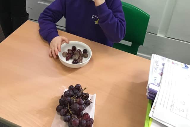 A pupil thanks Tesco for providing food through its partnership with FareShare.