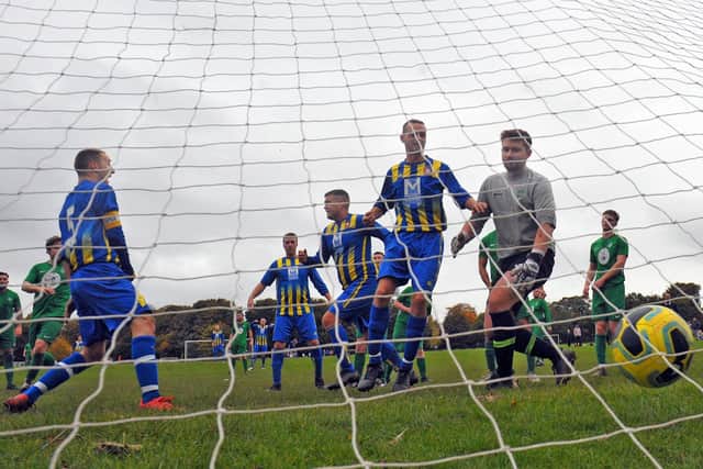 FC North Leeds inflicted the first defeat of the season on Sporting Pudsey with a 2-0 win in Division 4 of the Leeds Combination League. Dan Hurle, left, pictured opening the scoring for FC North Leeds. Picture: Steve Riding.