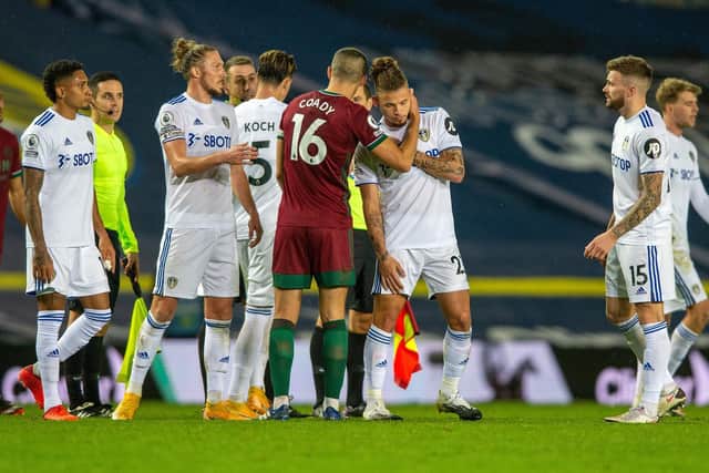INJURY VICTIM - Kalvin Phillips, being consoled by England team-mate Conor Coady, hurt his shoulder against Wolves and will be missing for Leeds United at Aston Villa on Friday. Pic: Bruce Rollinson