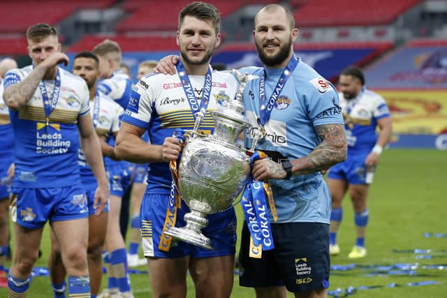 Brothers Tom and Luke Briscoe celebrate with the Challenge Cup trophy after the match. Picture: Ed Sykes/SWpix.com.