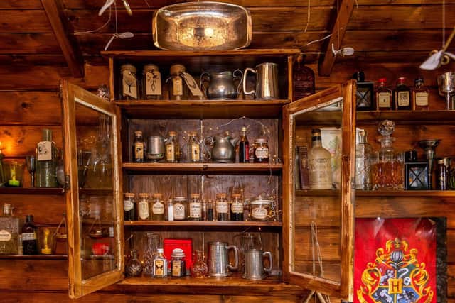 Harry Potter fans Dan Harrison and partner Mark Parkinson have transformed the summerhouse in the garden of their home at Thorner  into  wizarding  pub The Leaky Cauldron.
Photo: James Hardisty