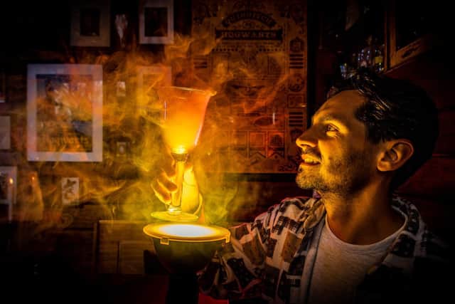 Harry Potter fans Dan Harrison (pictured) and partner Mark Parkinson have transformed the summerhouse in the garden of their home at Thorner  into  wizarding  pub The Leaky Cauldron.
Photo: James Hardisty