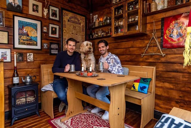 Harry Potter fans Dan Harrison (pictured right) and partner Mark Parkinson have transformed the summerhouse in the garden of their home at Thorner  into  wizarding  pub The Leaky Cauldron.
Photo: James Hardisty