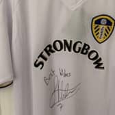 The LUFC shirt is signed by former player James Milner