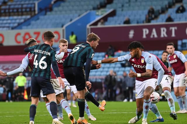 MAKE MINE A TREBLE! Patrick Bamford fires home his and Leeds United's third in Friday night's 3-0 romp at Aston Villa. Photo by Laurence Griffiths/Getty Images.