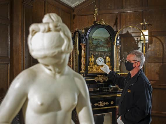 Michael Clark, visitor assistant at Temple Newsam House, adjusts the time on the Pyke Clock ready for when the clocks go back at 2am on Sunday October 25.
 Picture Tony Johnson