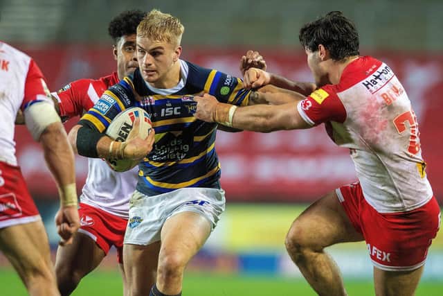 Alex Sutcliffe is held by James Bentley of St Helens.
Picture: Bruce Rollinson.