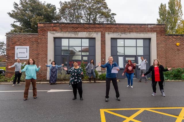 Members of the Space2Sing Wellbeing Choir outside Space2 behind the Old Fire Station, Gipton.