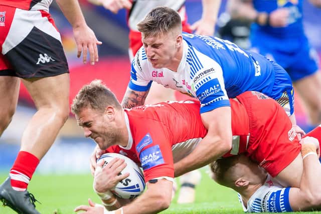 Salford's Lee Mossop is tackled by Alex Mellor in the Challenge Cup final. Picture: Allan McKenzie/SWpix.com.