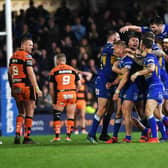 Rhinos celebrate Brad Dwyer's golden-point winning drop goal against Tigers in 2019. Picture by Jonathan Gawthorpe.