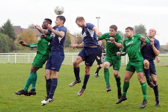 Leigh Rooks heads clear for Whitkirk Wanderers in their West Yorkshire League Premier Division encounter at Hunslet that finished one apiece. Picture: Steve Riding.