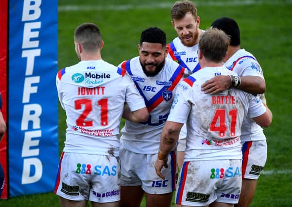 Double up: Wakefield Trinity players celebrate Eddie Battye's try in the Super League thrashing of Hull KR on Sunday. Picture James Hardisty.
