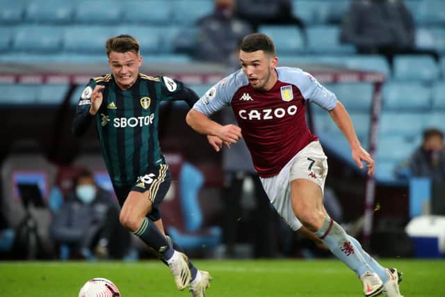 ENERGETIC: Leeds United midfielder Jamie Shackleton chases down John McGinn during Friday night's 3-0 victory against Premier League hosts Aston Villa. Photo by Nick Potts - Pool/Getty Images.