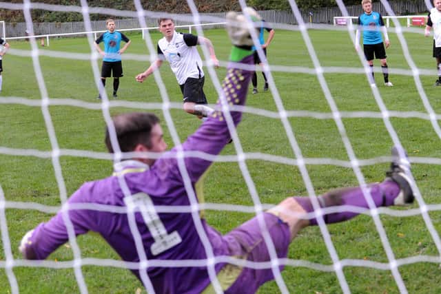 Scott Lightowler, of Littletown, is spot on with his penalty against Stanley United. Picture: Steve Riding.