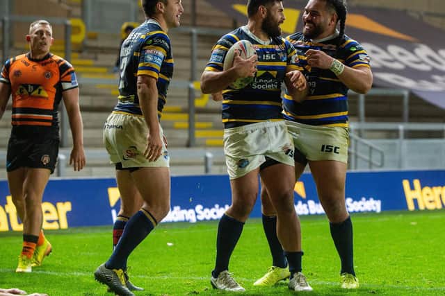 Rhyse Martin, centre, celebrates his try against Castleford with Tom Briscoe, left and Konrad Hurrell. Picture by Bruce Rollinson.