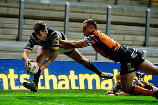 Tom Briscoe scores Leeds Rhinos' fourth try against Castleford Tigers. Picture: Bruce Rollinson.