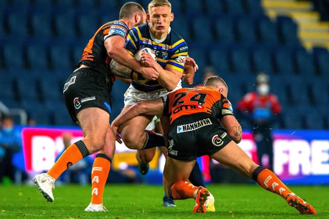 NO WAY THROUGH: Leeds Rhinos' Mikolaj Oledzki is held by Castleford's Daniel Smith and Tyla Hepi during Monday night's tussle.  Picture: Bruce Rollinson