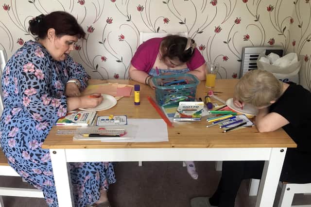 A kitchen table is transformed into a painter’s workshop as part of Artlink West Yorkshire’s plan help people access the joy of art.