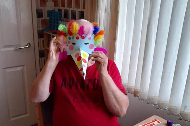 A mask of a different kind is made during one of Artlink’s remote sessions.