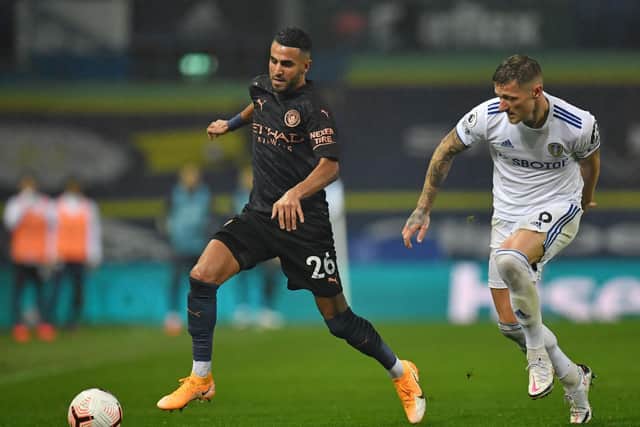 Leeds United captain Liam Cooper, right, pictured chasing Riyad Mahrez in last month's 1-1 draw at home to Manchester City. Photo by Paul Ellis - Pool/Getty Images.