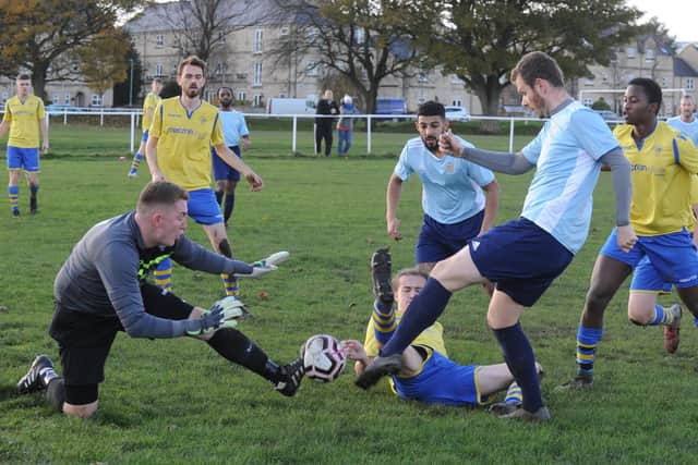 Brave 
Drighlington goalkeeper Ben Foster saves from Farsley's Craig Farrand. Picture: Steve Riding.