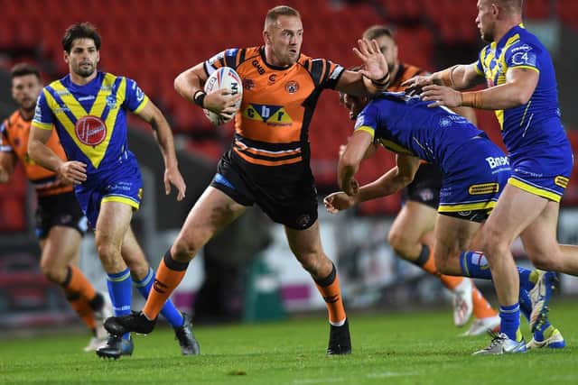 Liam Watts on the attack for Tigers against Warrington. Picture by Jonathan Gawthorpe.