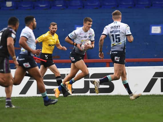 Ash Handley scores his second try in Rhinos' win at Wakefield last Sunday. Picture by Jonathan Gawthorpe.