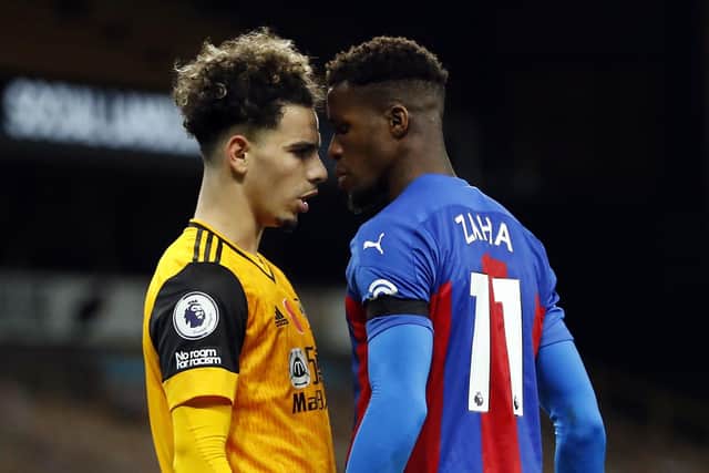 Crystal Palace's Wilfried Zaha, right, confronts Wolverhampton Wanderers' Rayan Ait-Nouri. Picture: Andrew Boyers/PA Wire.