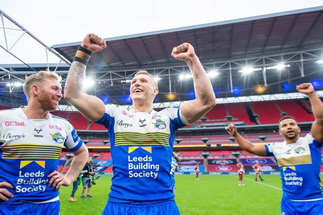 History-making Challenge Cup winner Mikolaj Oledzki (centre) has signed a new four-year contract with Leeds Rhinos. Picture: Allan McKenzie/SWpix.com.