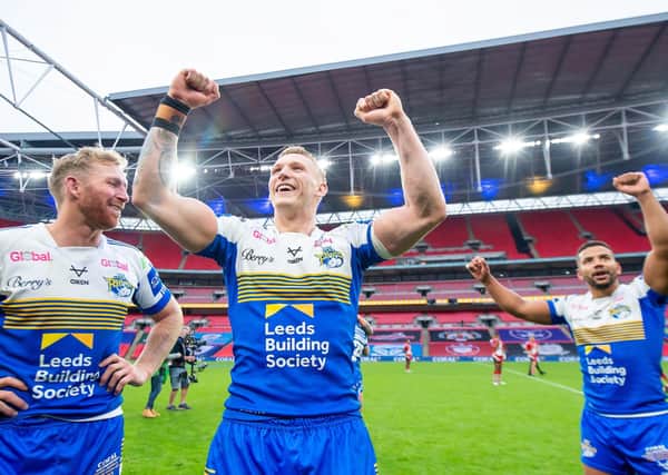 History-making Challenge Cup winner Mikolaj Oledzki (centre) has signed a new four-year contract with Leeds Rhinos. Picture: Allan McKenzie/SWpix.com.