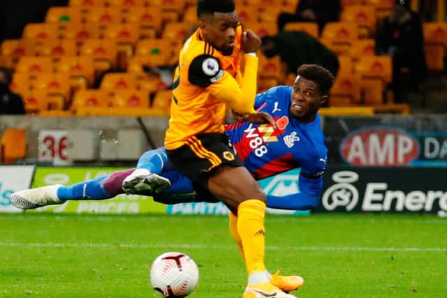 KEY MAN - Wilfried Zaha has a shot during the Premier League match between Wolverhampton Wanderers and Crystal Palace at Molineux. Pic: ANDREW BOYERS/POOL/AFP via Getty Images