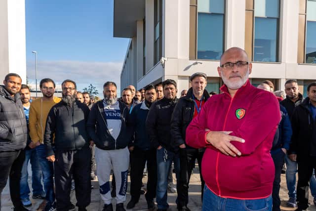Asif Afzal pictured with other taxi drivers at a protest outside Elland Road Police Station in Leeds last year