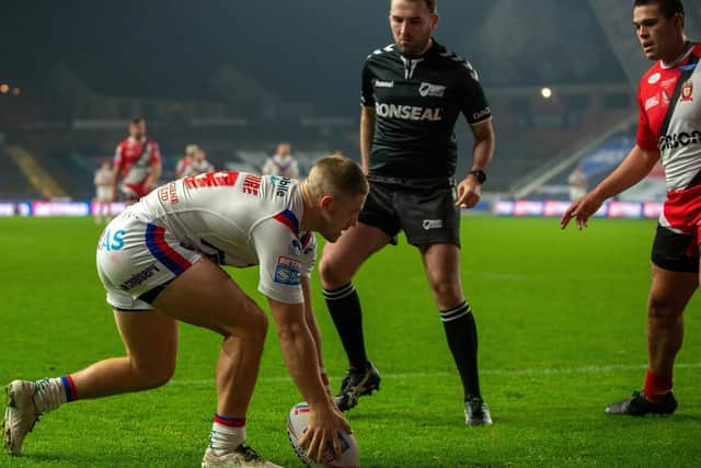 Ryan Hampshire scores the first of his two tries in Trinity's loss to Salford. Picture by Bruce Rollinson.