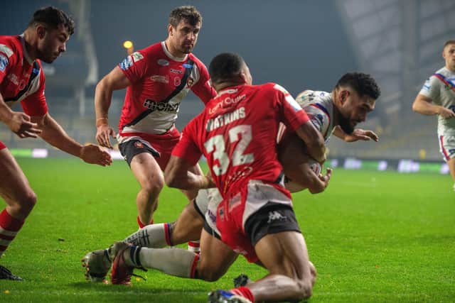 No stopping him: Trinity forward Kelepi Taginoa drives over for his second try against Salford.
 Picture Bruce Rollinson