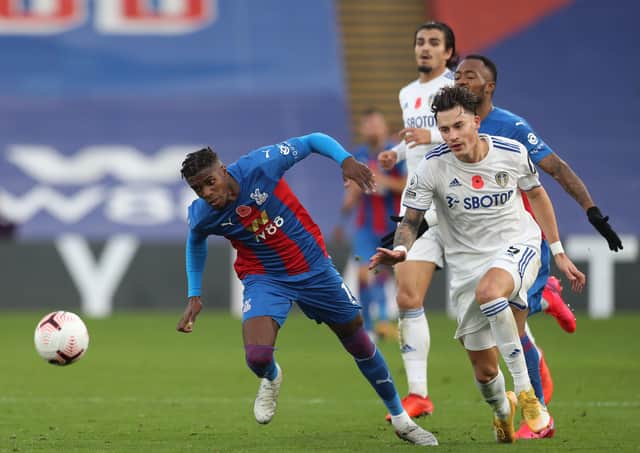 Palace's Wilfried Zaha is challenged by Robin Koch of Leeds United. Picture: Naomi Baker.