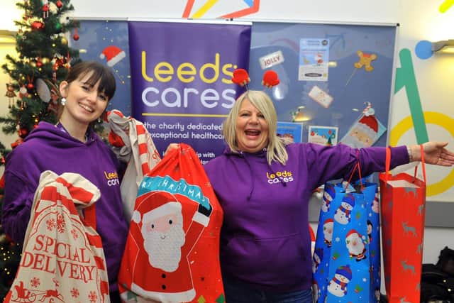 Jess Barrans (left) and Sue Baulk from Leeds Cares with some of the toys that have been donated in the reception of Leeds Childrens Hospital in 2019.