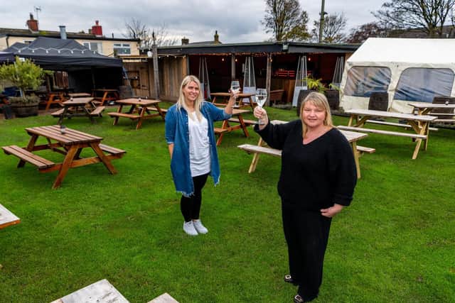 The rear beer garden at the Hare and Hounds pub on Batley Road, West Ardsley, which been nominated for the YEP Big Thank You Awards. Pictured (left to right) Keelie Moorby, bar manager, with landlady Jackie Fairburn. Picture: James Hardisty