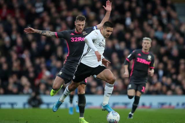 OLD FOES - Leeds United's Liam Cooper and Fulham's Aleksandar Mitrović face off again as Scotland take on Serbia in the Euro2020 qualifying play-off final tomorrow night. Pic: Getty