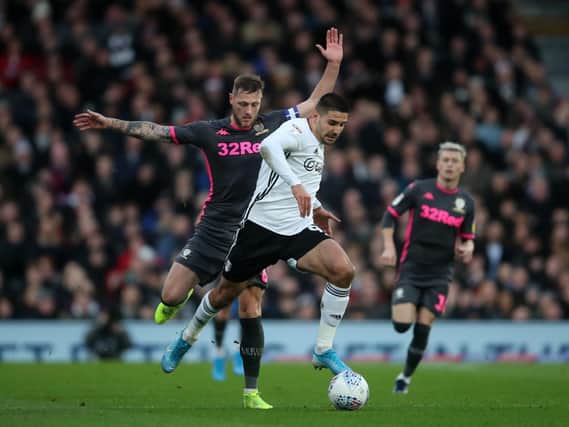 OLD FOES - Leeds United's Liam Cooper and Fulham's Aleksandar Mitrović face off again as Scotland take on Serbia in the Euro2020 qualifying play-off final tomorrow night. Pic: Getty