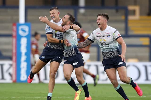 Luke Gale (centre) will be a key man for Leeds Rhinos in their play-off clash against CatalansDragons. Picture: Martin Rickett/PA Wire.