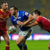 Leeds' Brett Ferres is tackled by Matt Whitley, of Catalans, in September's Super League meeting. Both players could feature on Friday. Picture by Bruce Rollinson.